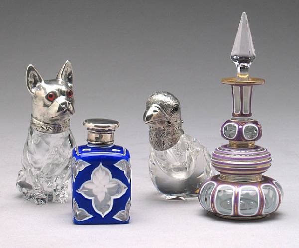 Appraisal: Four silver mounted glass bottles late th early th century