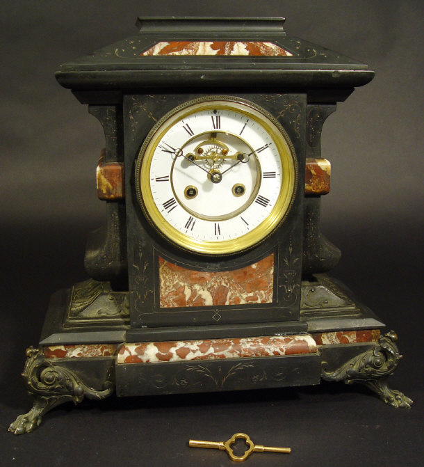 Appraisal: Victorian black slate and red marble mantel clock the enamel