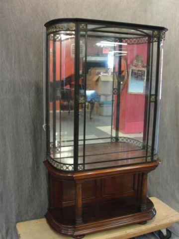 Appraisal: Neoclassical Style Metal And Curved Glass Vitrine On a wood