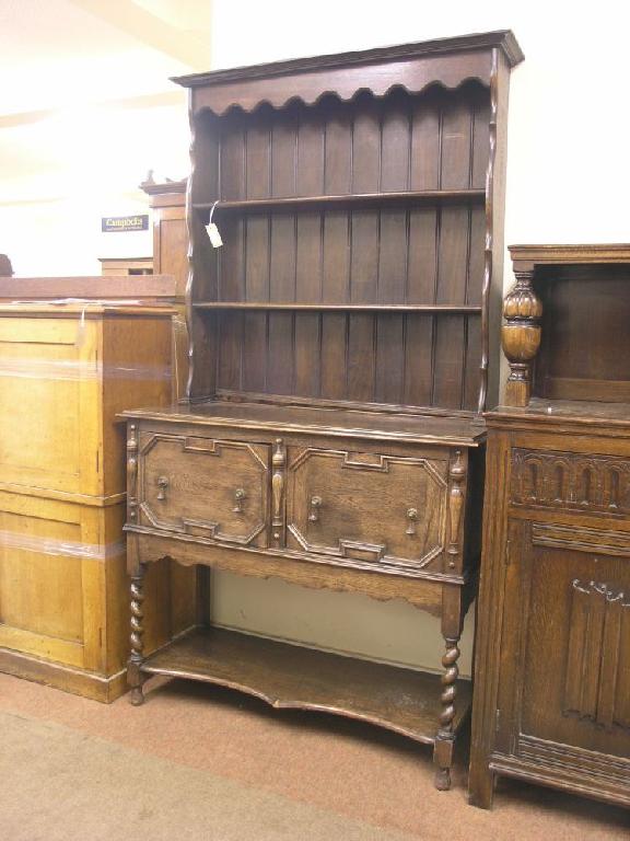 Appraisal: An early th century solid dark oak Welsh dresser two