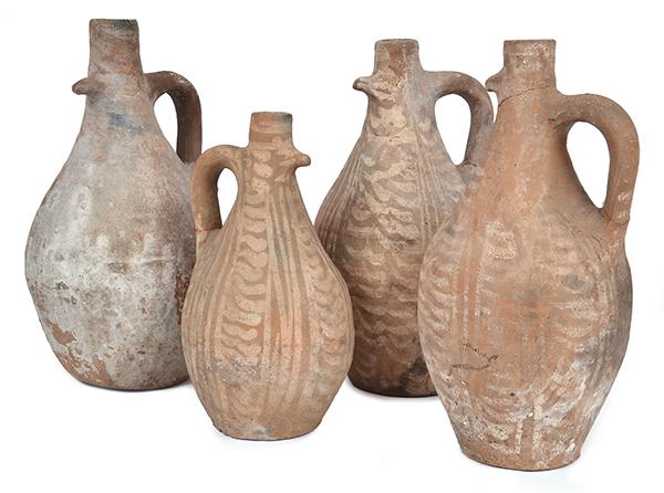 Appraisal: A COLLECTION OF FOUR TUSCAN EARTHENWARE WATER JUGS various sizes