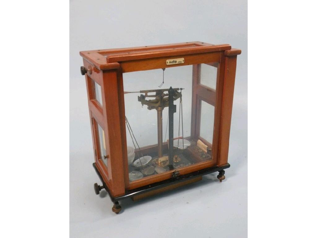 Appraisal: A set of Oertling chemists scales in a glazed fitted