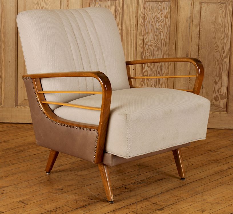 Appraisal: UPHOLSTERED ATOMIC CLUB CHAIR CIRCA An upholstered Atomic club chair