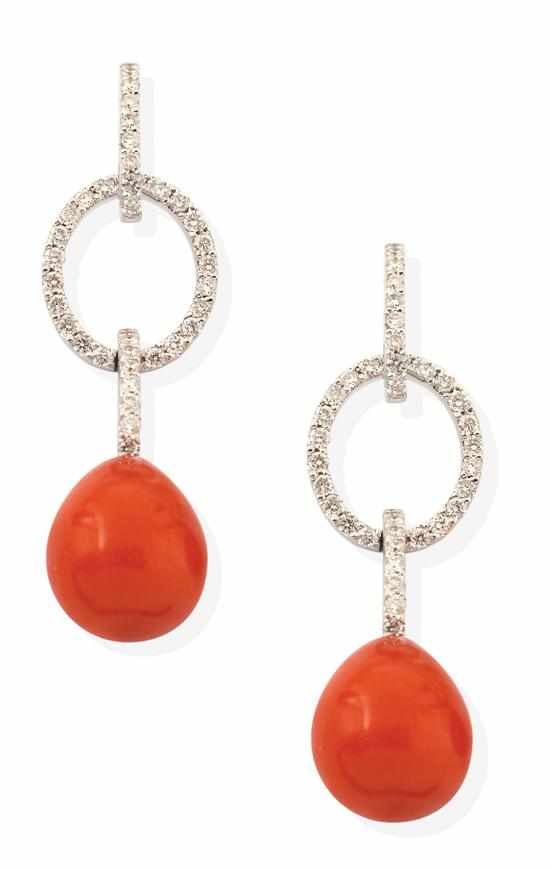 Appraisal: A PAIR OF CORAL AND DIAMOND EARRINGS Each earring set