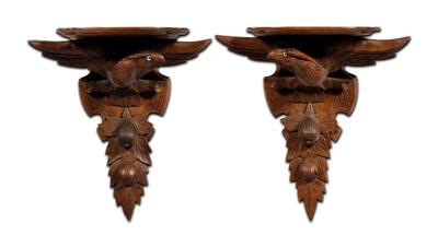 Appraisal: Pair eagle-carved brackets mahogany each with shaped shelf over spread-wing