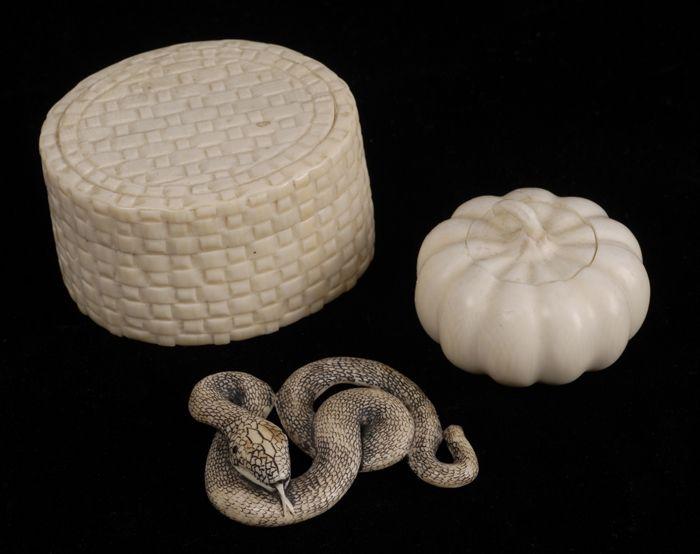 Appraisal: TWO CARVED IVORY SMALL BOXES Comprising an oval basketwaeve box