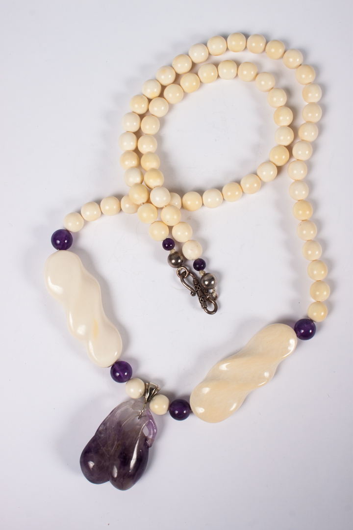 Appraisal: Ivory and amethyst bead necklace in L