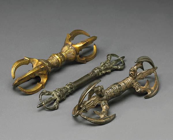 Appraisal: Three bronze vajra The first exhibiting three prongs issuing from