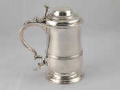 Appraisal: A Georgian silver tankard of conventional form with scroll thumbpiece