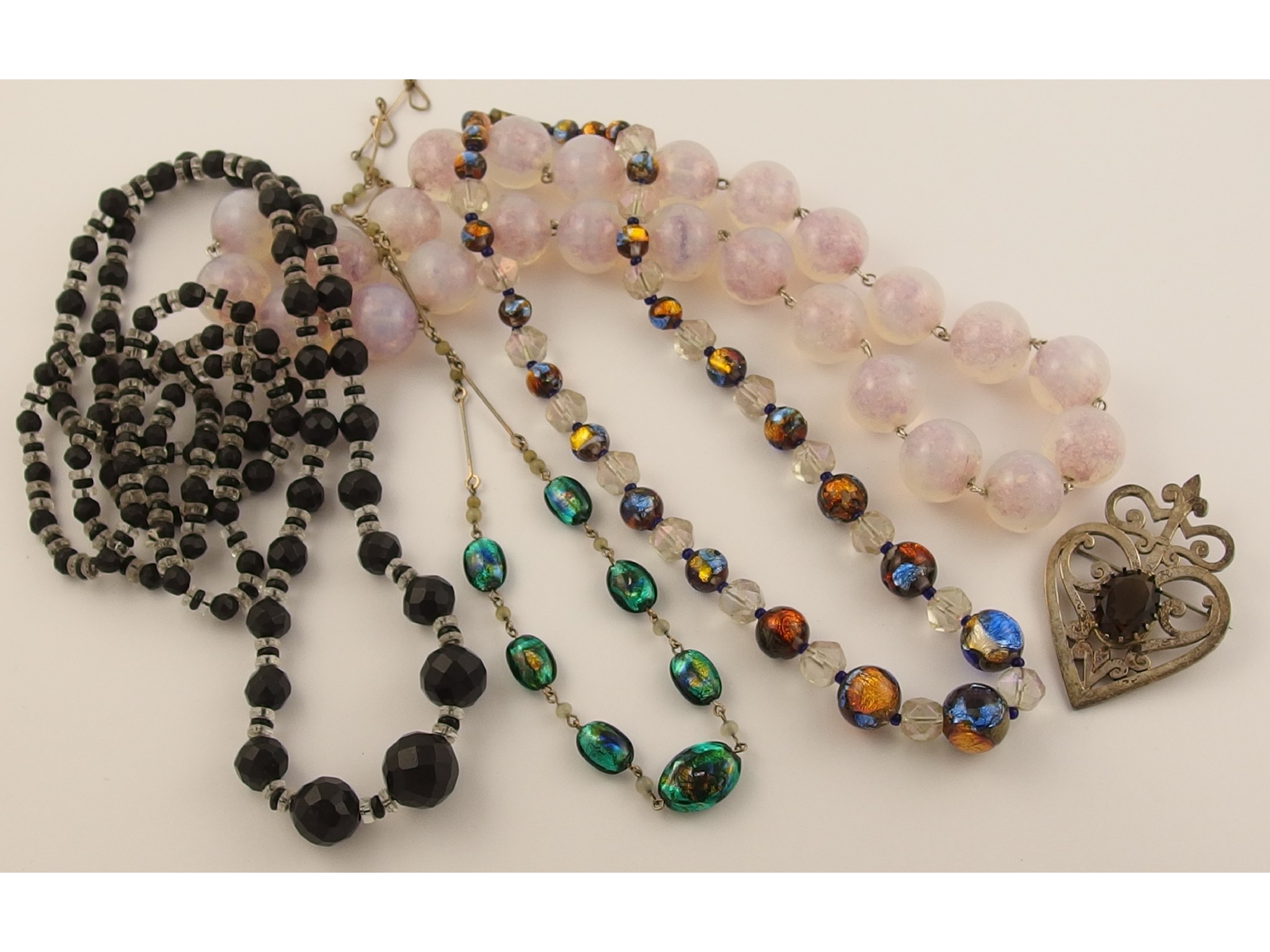 Appraisal: Two Venetian foiled glass bead necklaces a Malcolm Gray smoky