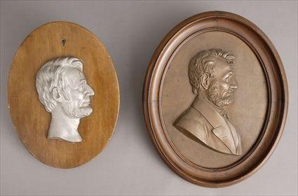 Appraisal: OVAL RELIEF PROFILE OF ABRAHAM LINCOLN AND A SILVERED METAL