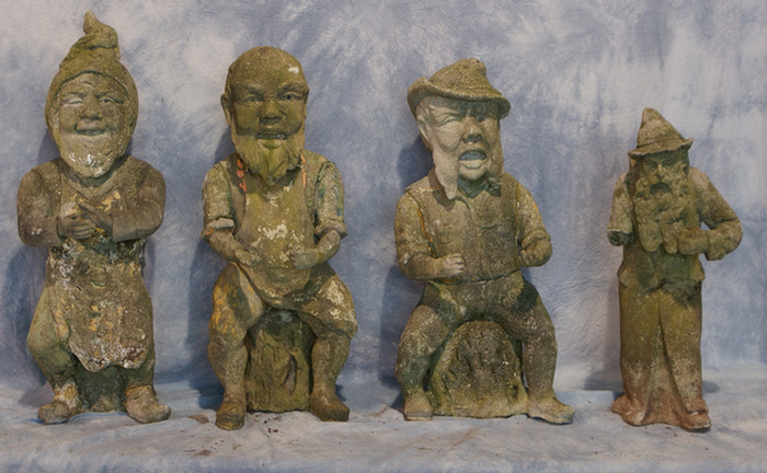 Appraisal: cast concrete garden figures of mythical gnomes each with losses