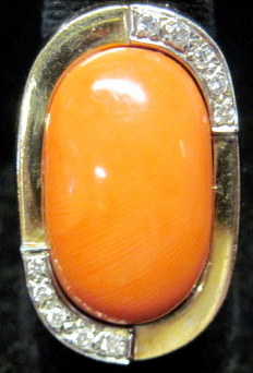 Appraisal: karat yellow gold coral and diamond ring Oval shaped cabochon