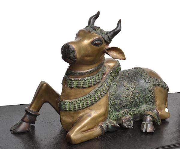 Appraisal: AN INDIAN BRONZE FIGURE OF A BULL the animal modelled