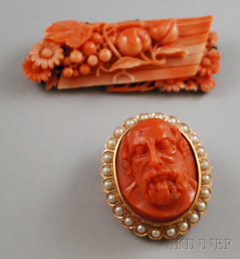 Appraisal: Two Carved Coral Brooches a cameo-style portrait medallion of a