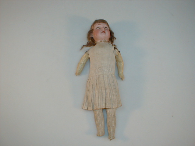 Appraisal: An Armand Marseille bisque headed small doll as found