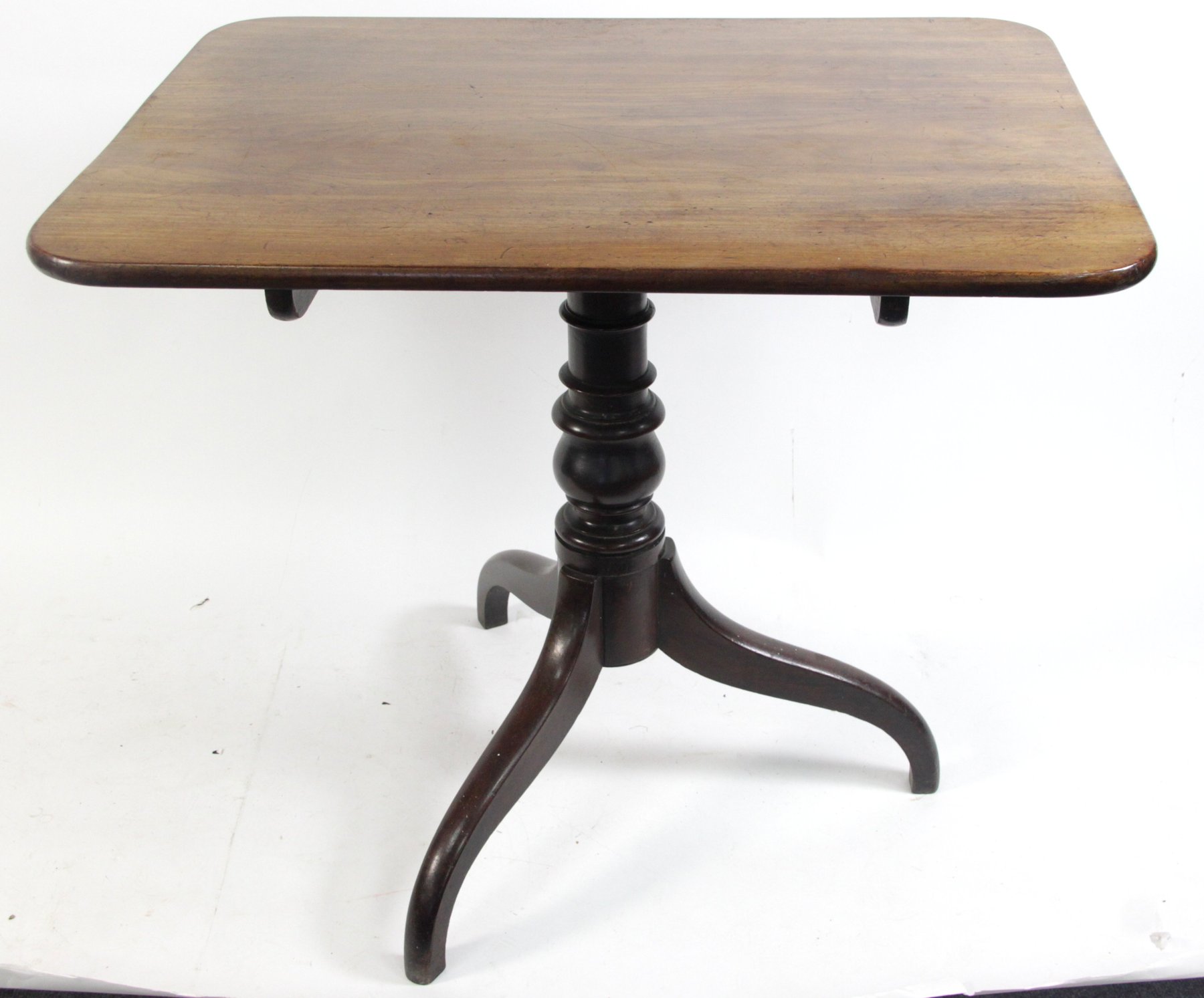 Appraisal: An early th Century mahogany tripod table with rectangular top