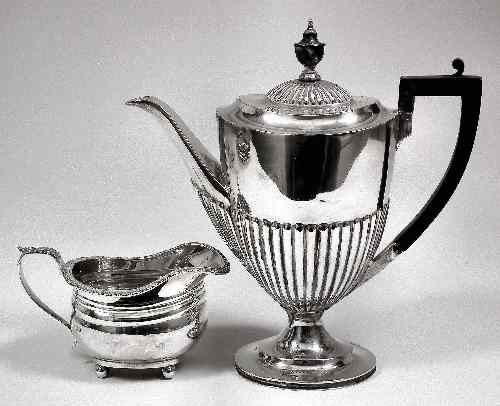 Appraisal: A George V silver oval part reeded coffee pot with