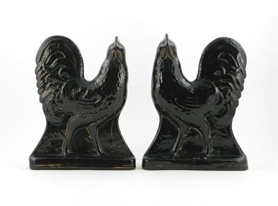 Appraisal: A pair of black glazed pottery cockerels probably Fife Pottery