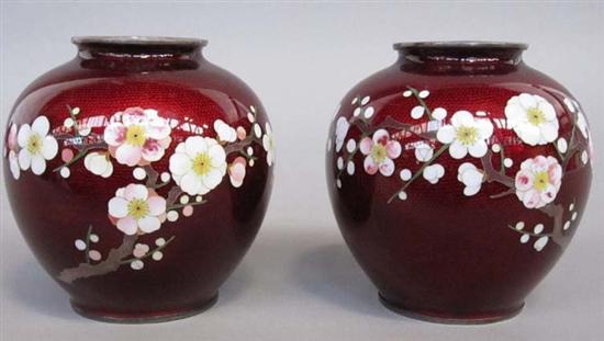 Appraisal: PAIR OF JAPANESE PRUNUS DECORATED RED GROUND ENAMEL VASES th