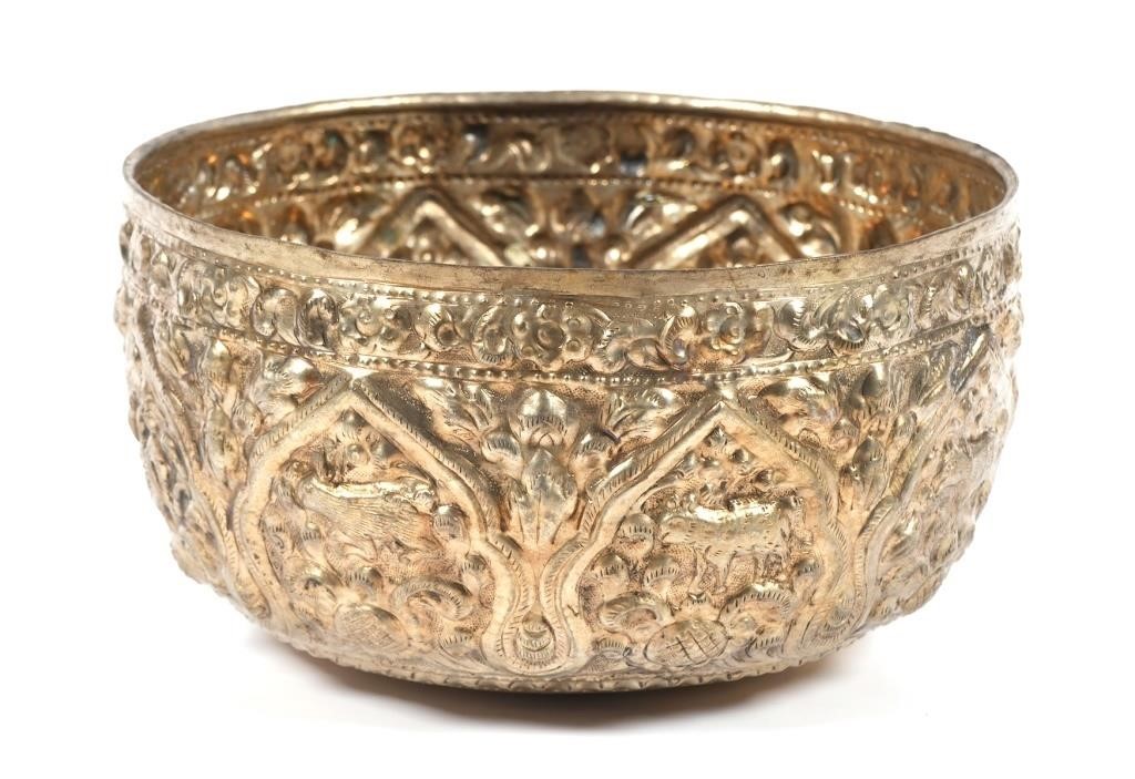 Appraisal: Burmese repousse silver bowl is decorated with animals and foliage