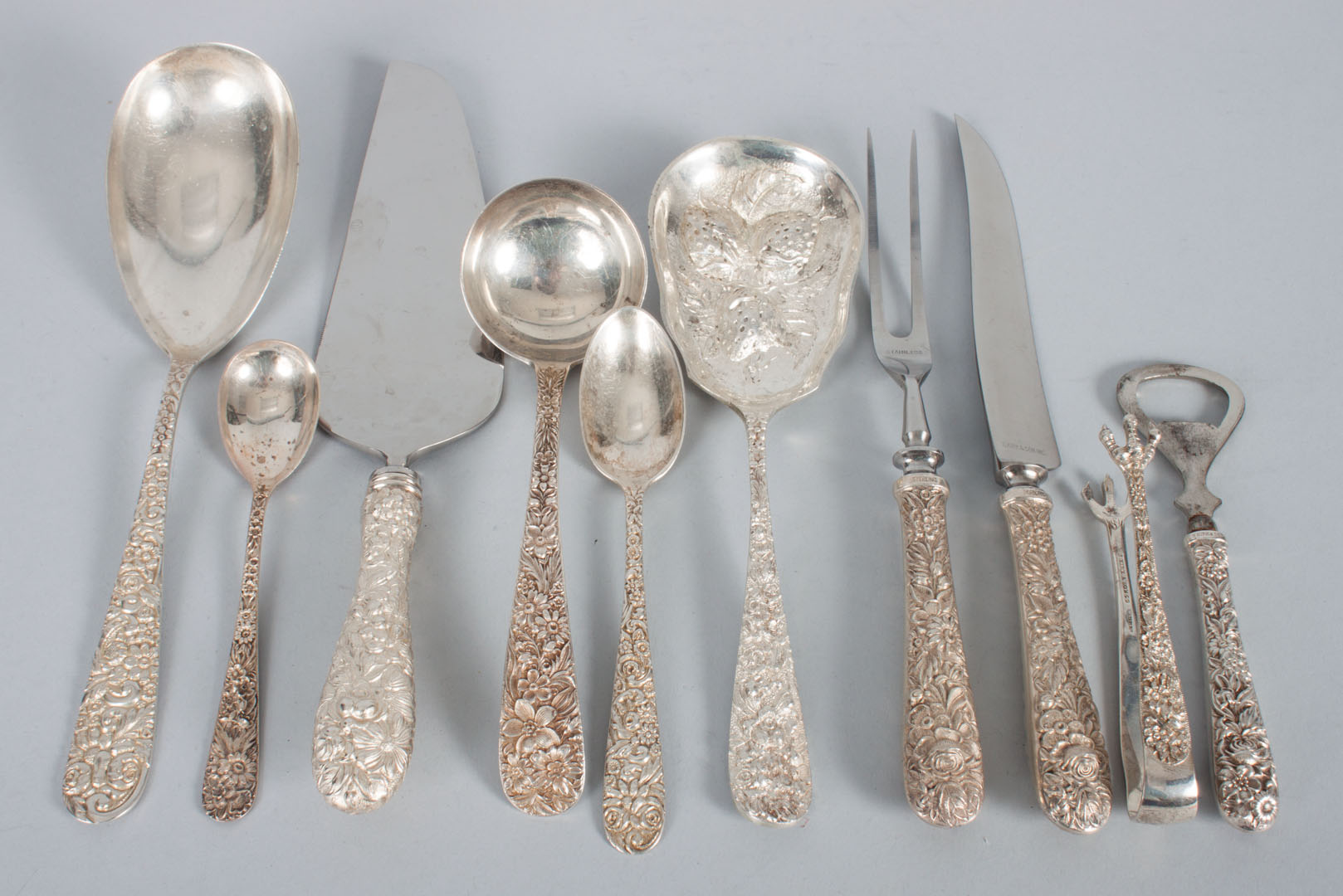 Appraisal: Ten sterling silver repousse serving pieces including Stieff berry spoon