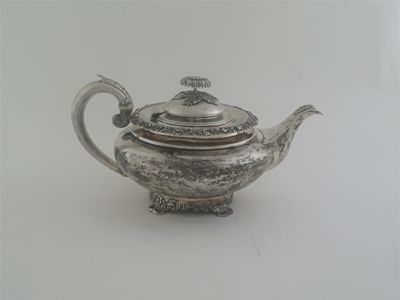 Appraisal: A William IV circular teapot with floral borders ornate feet