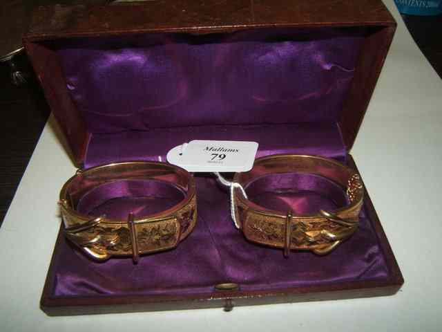 Appraisal: A PAIR OF GILT METAL BRACELETS in the form of