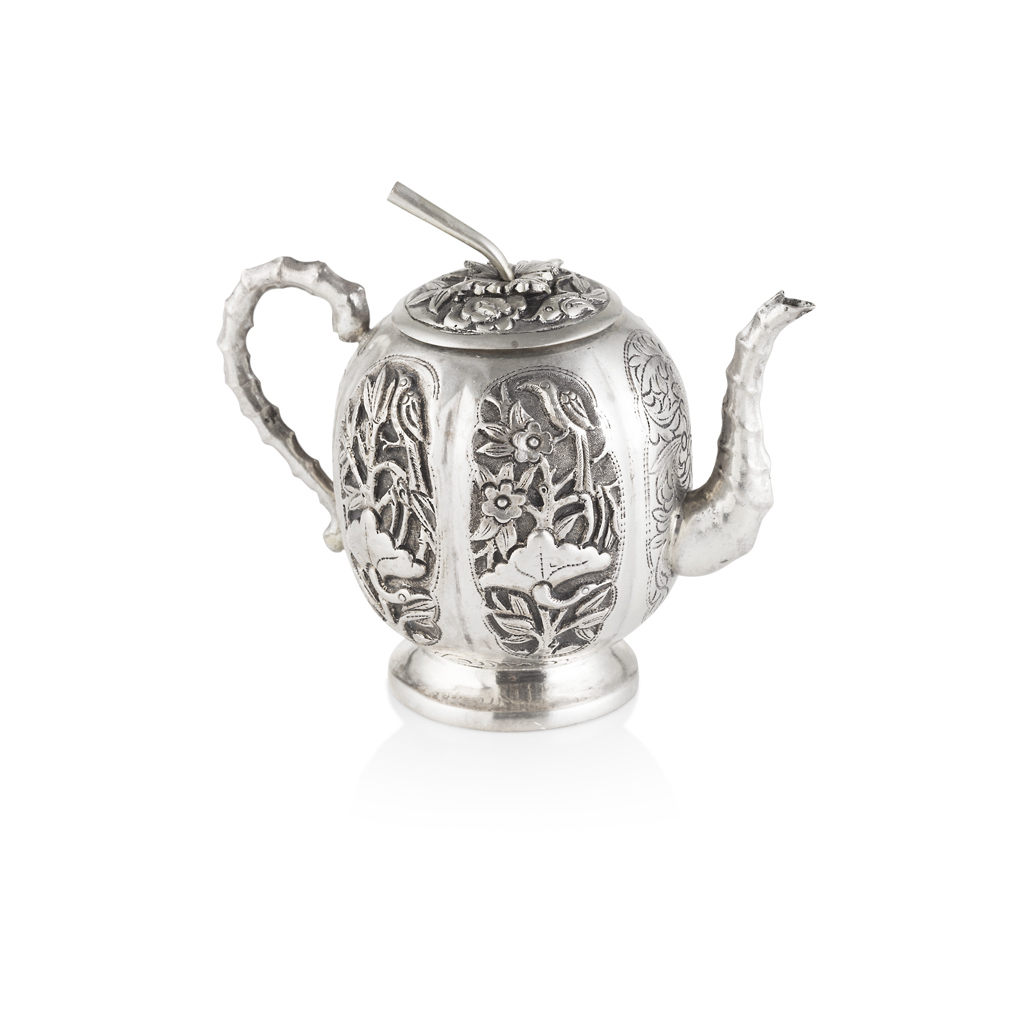 Appraisal: SMALL EXPORT SILVER TEAPOT the ovoid-shaped body decorated with four