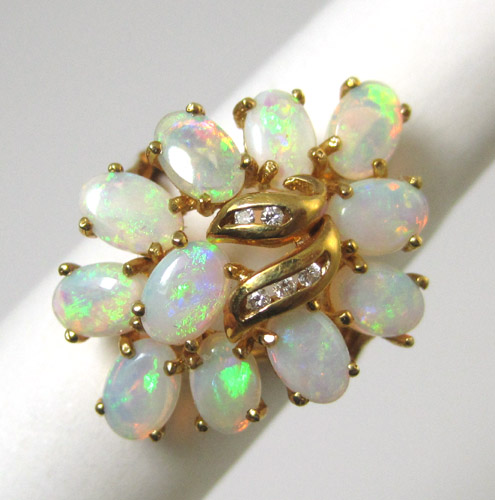 Appraisal: OPAL DIAMOND AND FOURTEEN KARAT GOLD RING set with a