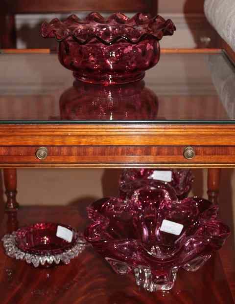 Appraisal: A CRANBERRY GLASS BOWL with wavy rim diameter together with