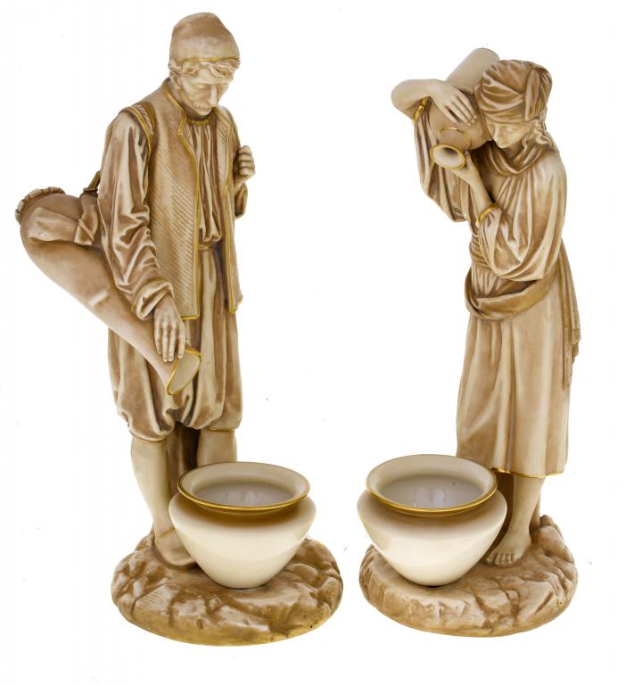 Appraisal: A PAIR OF ROYAL WORCESTER FIGURES OF EASTERN WATER CARRIERS