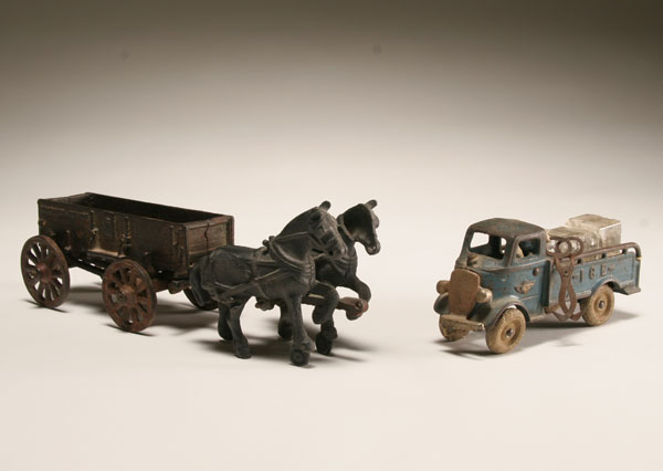 Appraisal: Arcade cast iron horse drawn toy and Mack ice truck