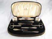 Appraisal: A boxed silver mounted manicure set with matched plated scissors