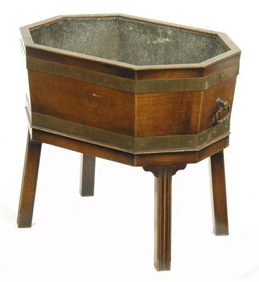 Appraisal: A mahogany and brass bound octagonal open wine cooler with