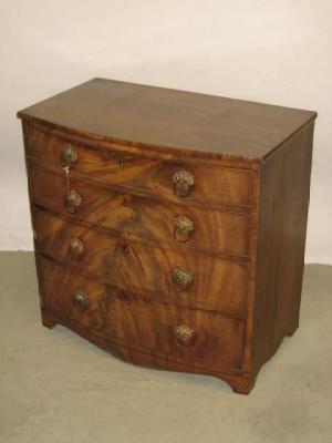 Appraisal: A MAHOGANY CHEST of bowed form with moulded edged top