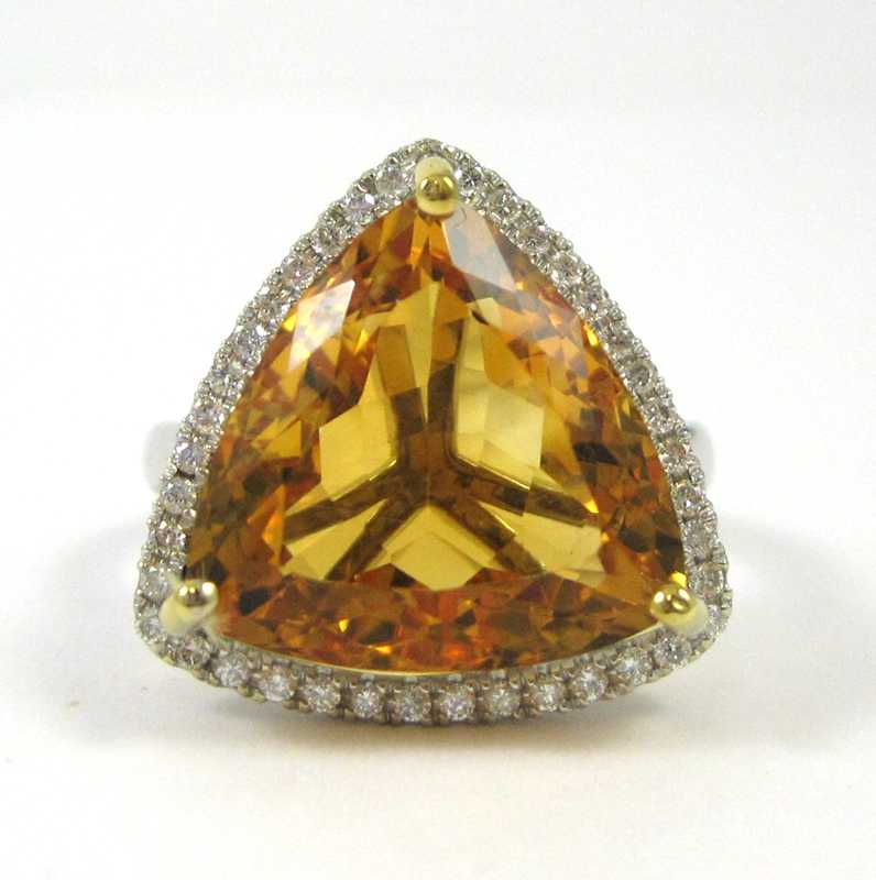 Appraisal: KARAT WHITE GOLD DIAMOND AND CITRINE RING the trillion-cut citrine