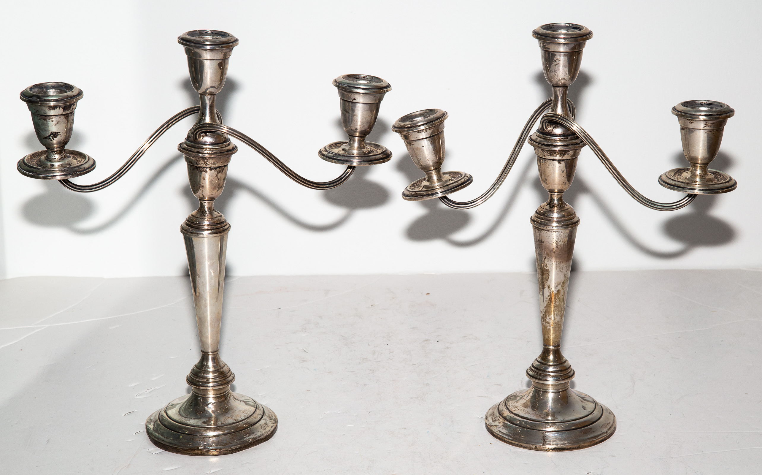 Appraisal: A PAIR OF ALVIN WEIGHTED STERLING CANDELABRA Each with three