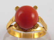 Appraisal: A yellow metal tests carat gold coral set ring the