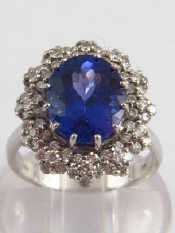 Appraisal: A white metal tests carat gold tanzanite and diamond ring