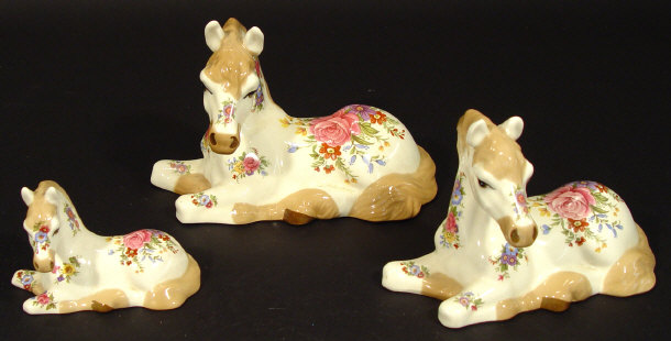 Appraisal: Graduated set of three Szeiler china horses each decorated with