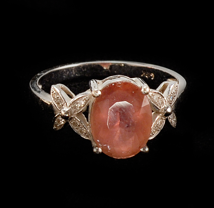 Appraisal: KT WHITE GOLD PINK TOURMALINE AND DIAMOND RING Faceted oval