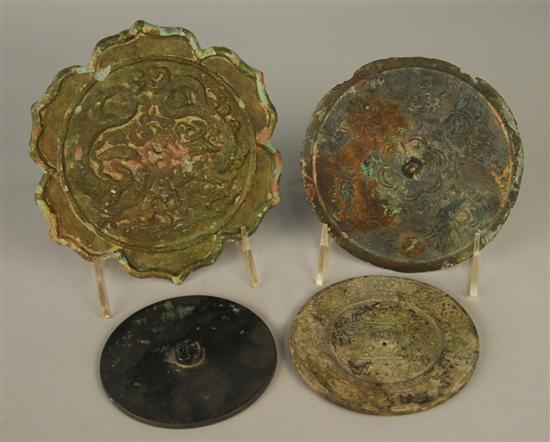 Appraisal: FOUR CHINESE ARCHAIC STYLE BRONZE CIRCULAR MIRRORS one bears red