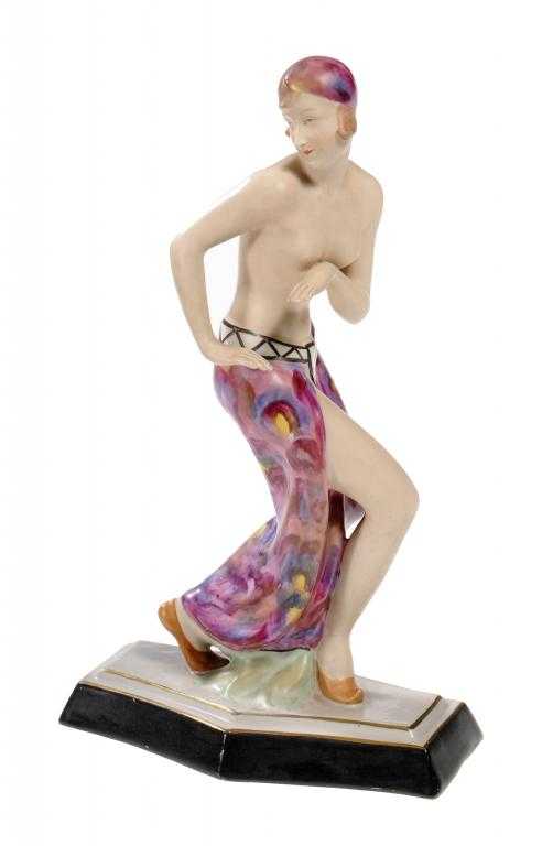 Appraisal: A ROYAL DUX FIGURE OF AN EXOTIC DANCER the semi-naked