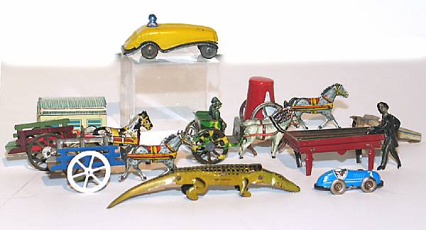 Appraisal: Grouping of penny toys Lot includes early German pool player