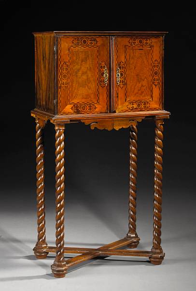 Appraisal: A German Baroque marquetry and parcel ebonized walnut cabinet on