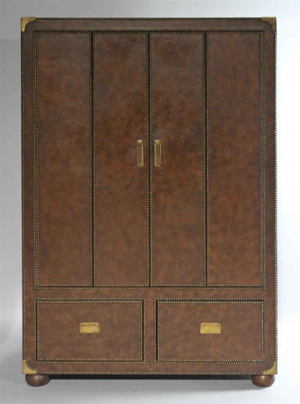 Appraisal: FERGUSON COPELAND LTD TOBACCO BROWN LEATHER AND BRASS TRIMMED CABINET