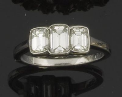 Appraisal: A diamond three stone ring The three emerald cut diamonds