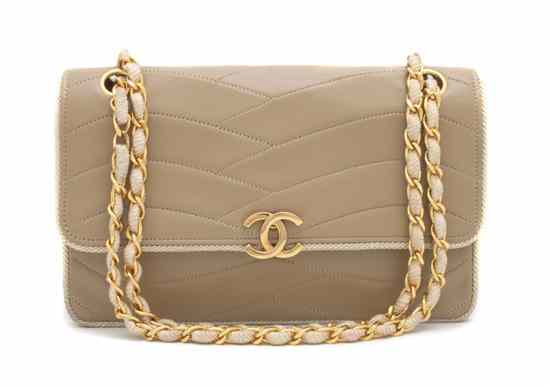 Appraisal: A Chanel Tan Leather and Cord Bag with a chainlink