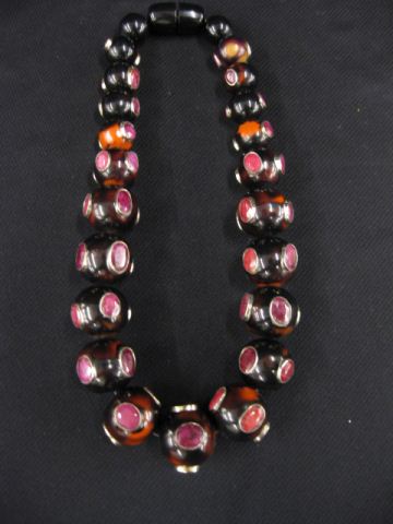 Appraisal: Ruby Bakelite Necklace graduated beads set with rich African gems